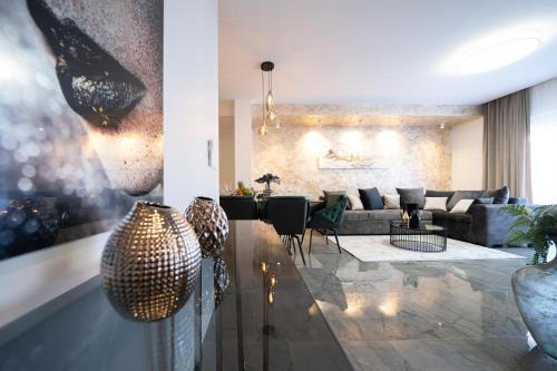 a living room with a couch and a table at D-Palace-Lux in Donji Zemunik