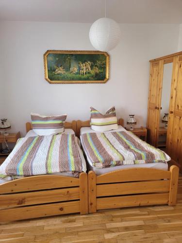 two beds sitting next to each other in a room at Ferienwohnung Familie Klingohr in Erfurt