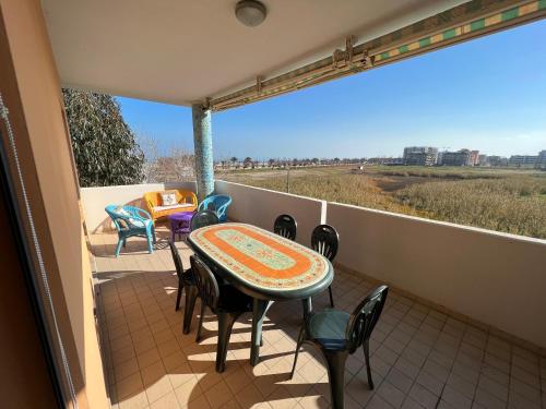 a patio with a table and chairs on a balcony at Bellavista in San Salvo