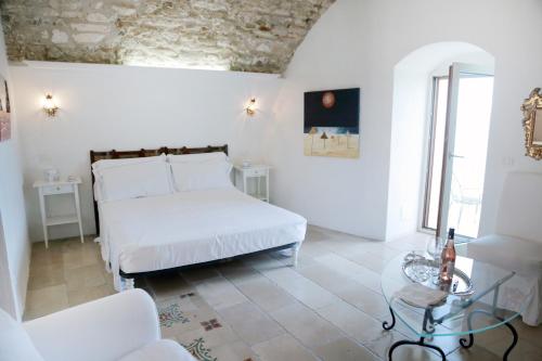 Postel nebo postele na pokoji v ubytování Gli Orti Di Malva B&B