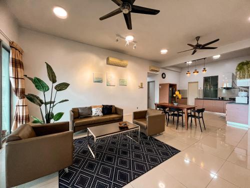 a living room with a couch and a table at Maison life 小居屋 The Loft Imago in Kota Kinabalu