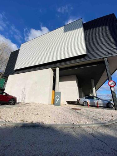a building with a car parked in front of it at Las Tontunas in Madrid