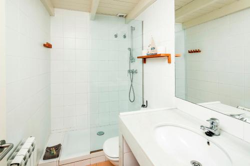 a bathroom with a shower and a sink and a toilet at Apartment Cadaques in Cadaqués