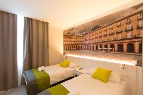 Кровать или кровати в номере Bilbao City Rooms