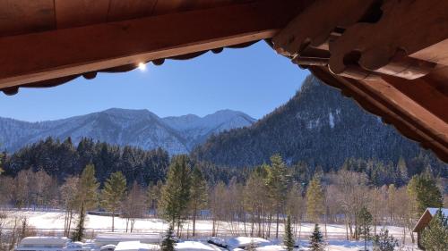 a view of the mountains from a log cabin at Apartements Ingrid Unhoch-Raggl in Oberammergau
