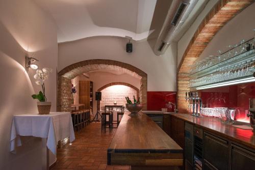 a kitchen with a long wooden table in a room at Hotel Marc Aurel - Vienna City Center in Vienna