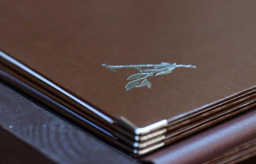 a brown book with a picture of a bird on it at Hotel Marc Aurel - Vienna City Center in Vienna
