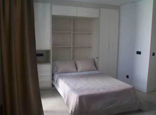 Katil atau katil-katil dalam bilik di Apartamentos Las Pasaeras