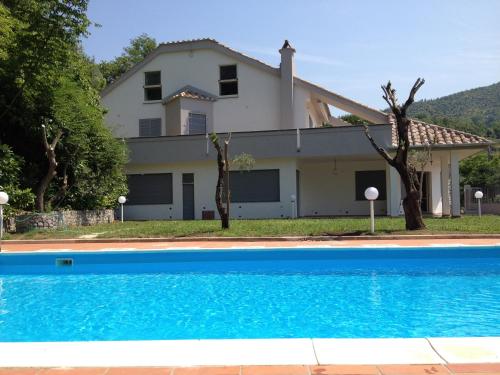 a house with a swimming pool in front of it at Villa D&D in Cava deʼ Tirreni