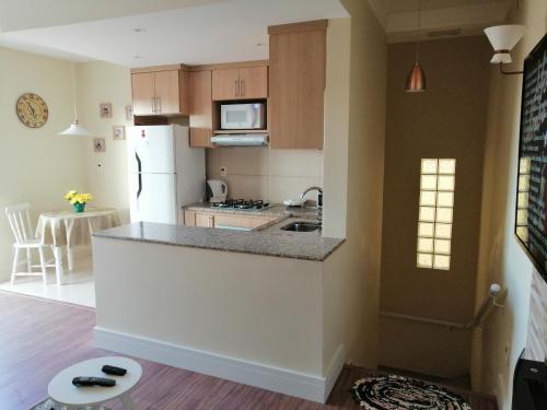 Kuchyň nebo kuchyňský kout v ubytování Apartamento Aconchegante de luxo da Elena