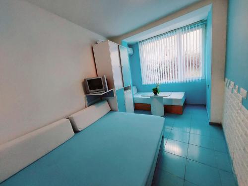a small room with a couch and a window at APARTMENT LEO 3 in Varna City