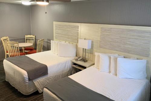 A bed or beds in a room at Francis Scott Key Family Resort