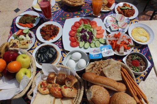 a table topped with lots of different types of food at Osiris Hotel Cairo in Cairo
