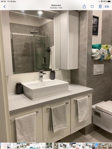 a bathroom with a sink and a toilet at Sole in Makarska