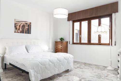 מיטה או מיטות בחדר ב-Villa Liliana - Large Private House in Vicopisano