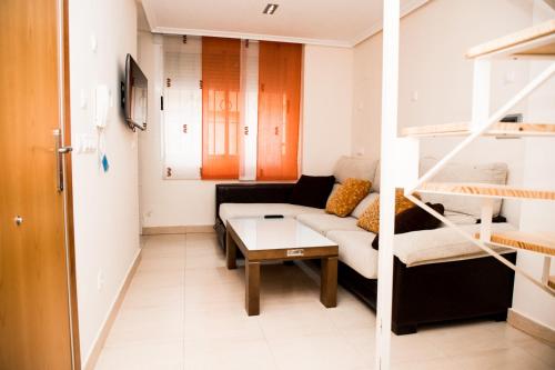 Posteľ alebo postele v izbe v ubytovaní DUPLEX LOFT en la PLAYA