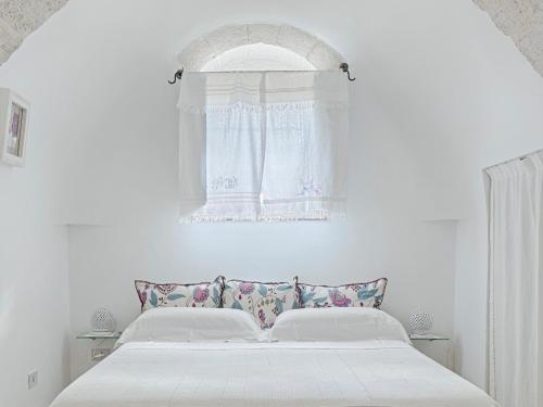 Giường trong phòng chung tại Trullo Santangelo