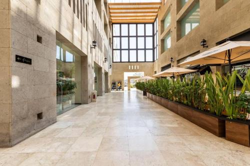 an empty hallway in a building with plants at Antigua Hotel Boutique in Mexico City