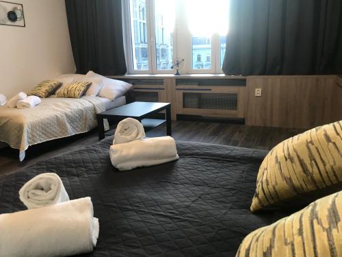 Postel nebo postele na pokoji v ubytování Old Town Boutique Apartments