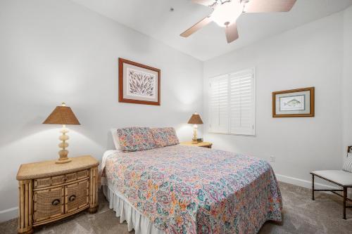 a bedroom with a bed and a ceiling fan at 851 Cinnamon Beach in Palm Coast