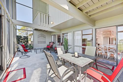 a patio with tables and chairs and windows at Ponte Vedra Deer Run 9770 in Ponte Vedra