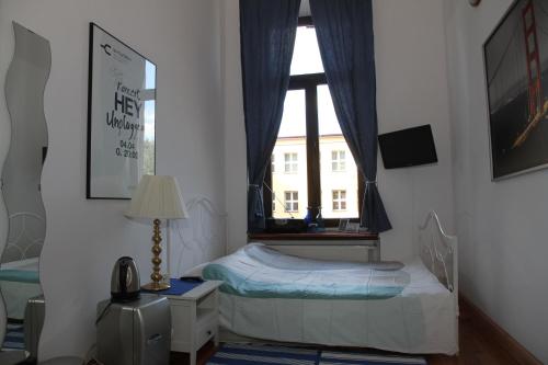 Postel nebo postele na pokoji v ubytování Pokoje Gościnne P.O.W. 17