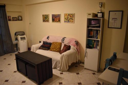 a living room with a couch and a tv at Altos de Santiago Bed & Breakfast in San Miguel de Tucumán