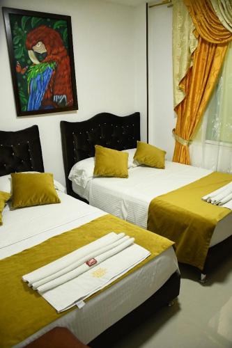 Postel nebo postele na pokoji v ubytování Hotel Hormiga Real