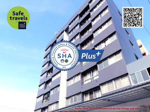 a building with a sign that reads shka plus at Lee Place Phatthanakan Condo in Bangkok