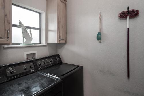 a kitchen with a stove and a refrigerator at Robins Nest in Ruidoso
