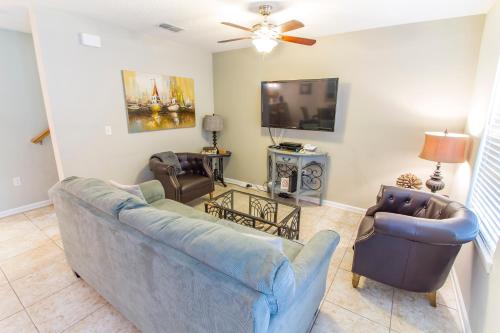 a living room with a couch and two chairs at Averys Ocean Breeze in Butler Beach