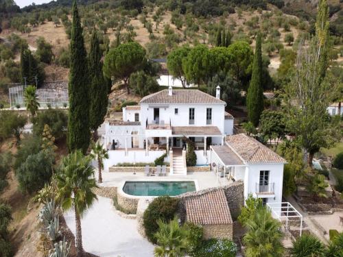 an aerial view of a white house with a swimming pool at Exclusive historic Villa in the heart of Andalucian - La Villa Magdalena in Ronda