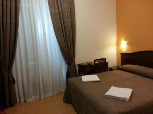 Posteľ alebo postele v izbe v ubytovaní Guesthouse Alex II