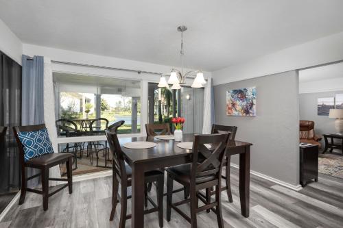 a dining room and living room with a table and chairs at Deer Run 9767 in Ponte Vedra