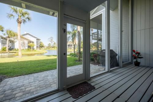 a screened porch with sliding glass doors on a house at Deer Run 9767 in Ponte Vedra