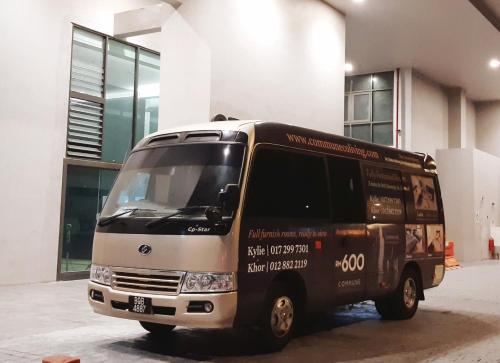 a van parked in front of a building at Sunway Paradise Home Staycation PH2120 SELF CHECK IN OUT in Subang Jaya