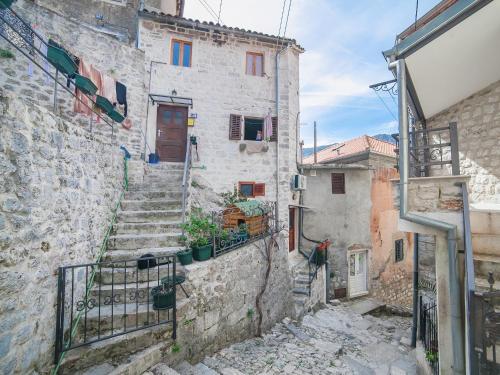an alley with stairs leading up to a building at Apartment Alexandra in Kotor
