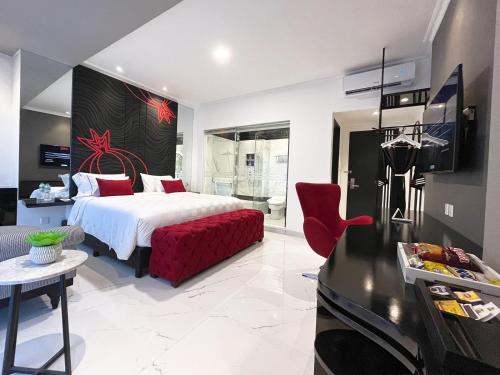 a hotel room with a bed and a kitchen at MORITZ SMART BANDUNG in Bandung