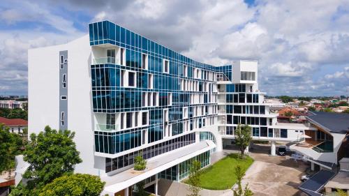 an overhead view of a white building with blue windows at VELA Dhi Udon Thani in Udon Thani