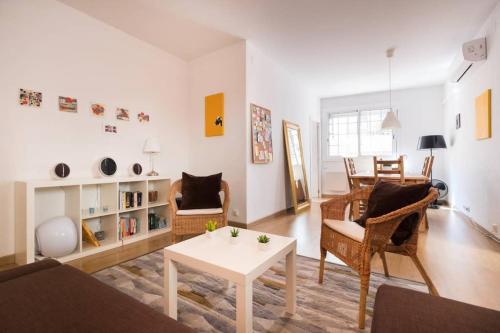 a living room with a couch and a table at Apartment Vallhonrat in Barcelona