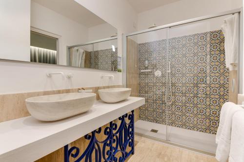 Ванна кімната в Phi Hotel La Tonnara di Bonagia