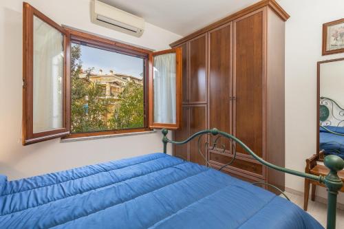 En eller flere senge i et værelse på Casa Raftin