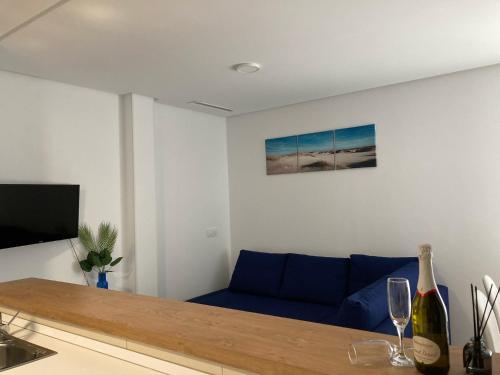Televízia a/alebo spoločenská miestnosť v ubytovaní Apartamento Río Iro
