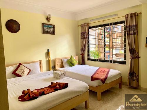 Ένα ή περισσότερα κρεβάτια σε δωμάτιο στο SaPa Peace Valley hotel