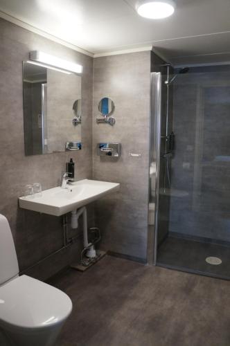 a bathroom with a sink and a shower at Best Western Hotel Corallen in Oskarshamn