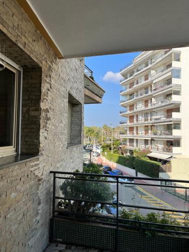 a balcony of a building with a view of a street at palm Beach studio vue port Canto in Cannes