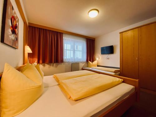 Una cama o camas en una habitación de Appartements Juen