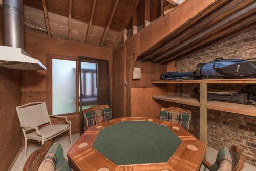 a room with a table and chairs in a room at Cowboys, Indians and Outlaws in Ruidoso