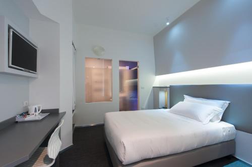Posteľ alebo postele v izbe v ubytovaní Executive Inn Boutique Hotel