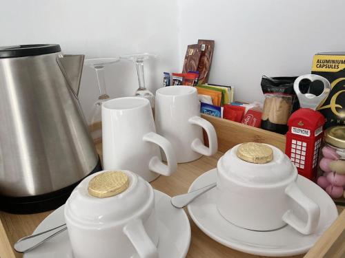 a counter with two white tea pots and a blender at Prestbury Bed & Breakfast in Salisbury